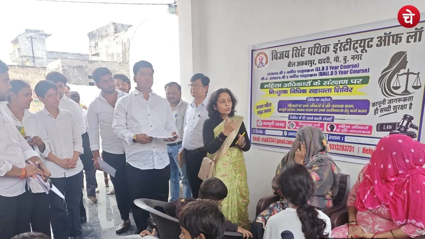 Faculty members from the Vijay Singh Pathik Institute of Law informing women about their legal rights in the Nai Basti area of __Dadri
